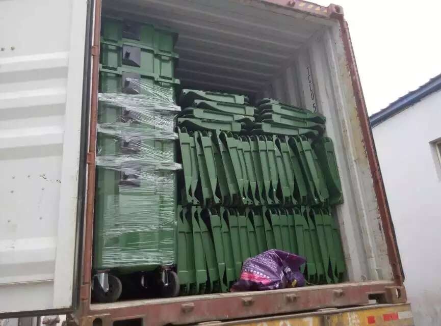 dustbin loading in container.jpg